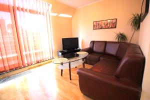 a living room with a couch and a table at Lucky Apartaments Old Town -Economy in Wrocław