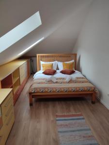 a bedroom with a large bed in a attic at RETRO HOUSE in Braşov