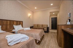 Voodi või voodid majutusasutuse Palermo Hotel toas