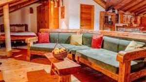 a living room with a couch and a bowl of fruit at Old Wine House - Montenegro in Herceg-Novi