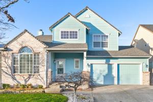 a house with a blue at The Place To Be; With A Hot Tub! in Clackamas