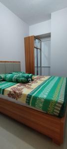 Ліжко або ліжка в номері Apartemen 2BR Dengan Fasilitas Waterpark