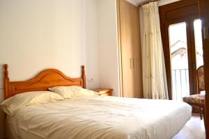 Postel nebo postele na pokoji v ubytování Apartament familiar amb vistes i cèntric by RURAL D'ÀNEU