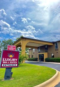 a luxury inn and suites entrance to a building at Luxury Inn & Suites in Selma