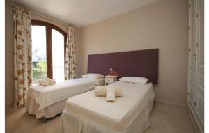 A bed or beds in a room at Gorgeous Home In Benahavís With Wifi