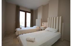 A bed or beds in a room at Gorgeous Home In Benahavís With Wifi