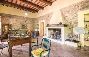 a living room with a table and a fireplace at Vista Piscina in Migliano