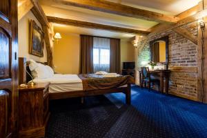 Postel nebo postele na pokoji v ubytování Hotel Marysin Dwór