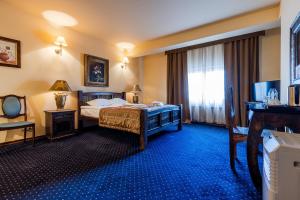 Postel nebo postele na pokoji v ubytování Hotel Marysin Dwór