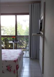 Et tv og/eller underholdning på FLATS MONTE CASTELO GRAVATÁ CONDOMÍNIO AO LADO do HOTEL FAZENDA