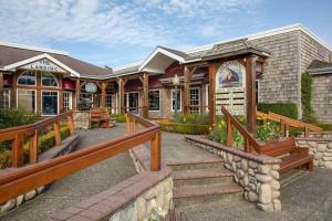 a building with a staircase leading up to a building at Cannon beach vibes, steps to the beach,WIFI,3 full bedroom en suites with 3 fireplaces,Near Downtown in Cannon Beach