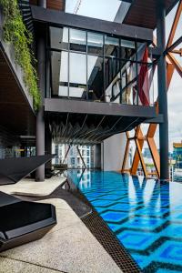 a view of a building with a swimming pool at Scarletz Suites KLCC by Mana-Mana in Kuala Lumpur