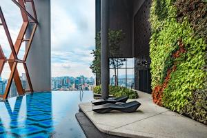 a view of a building with a swimming pool at Scarletz Suites KLCC by Mana-Mana in Kuala Lumpur