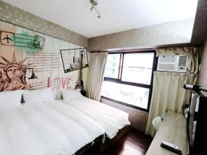 Postel nebo postele na pokoji v ubytování Feng Chia Hygge