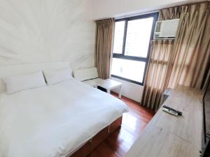 Postel nebo postele na pokoji v ubytování Feng Chia Hygge