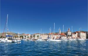 a bunch of boats are docked in a harbor at Lovely Apartment In Okrug Gornji With Wifi in Trogir