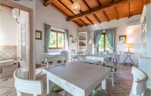 a dining room with a table and chairs at Villa Luca in Vitorchiano