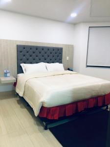 Postel nebo postele na pokoji v ubytování Hotel San Antonio Guarne