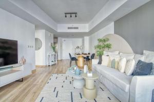 TV a/nebo společenská místnost v ubytování The Smart Concierge - Damac Waves
