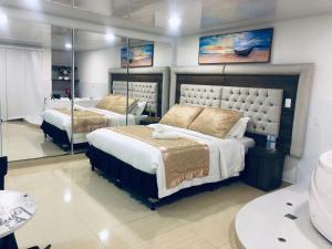 Postel nebo postele na pokoji v ubytování Hotel San Antonio Guarne