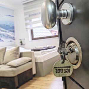 a padlock on the door of a living room at Apartman Ice age Jahorina in Jahorina