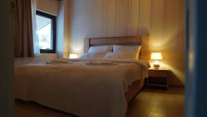 Cama o camas de una habitación en Zarku Apartments