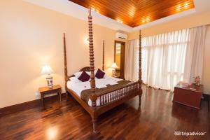 A bed or beds in a room at The Hotel @ Tharabar Gate