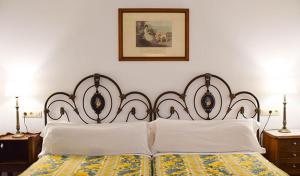 Postel nebo postele na pokoji v ubytování Hotel Los Caspios