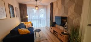 TV a/nebo společenská místnost v ubytování Apartament MAG