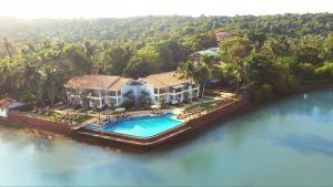 an aerial view of a house on the water at Acron Waterfront Resort in Baga