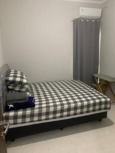 Llit o llits en una habitació de Awana Dream Gateway Pasteur