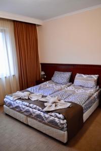 Postel nebo postele na pokoji v ubytování Elinor Apartment - Downtown