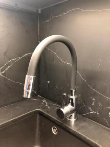 a kitchen sink with a faucet on a counter at Balcón del Puerto Luxury Suite - VUT-3921-AS in Gijón +23 photos