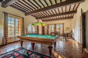 a pool table in the middle of a room at Suite le Quervalat dans magnifique bastide 18eme in Aix-en-Provence