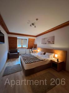 Ένα ή περισσότερα κρεβάτια σε δωμάτιο στο Apartman 206 Jahorina - Hotel Vucko