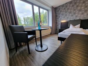 Postel nebo postele na pokoji v ubytování Nordic Avantage Hotel