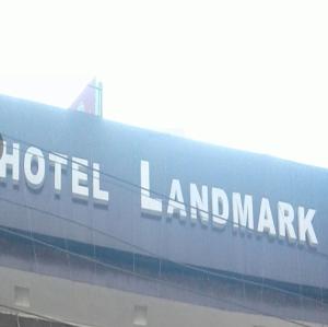 a sign for a hotel land market on the side of a train at Hotel Landmark Lodge, Jammu in Jammu