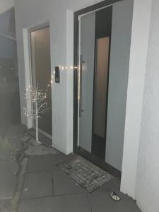 a door to a building with a door mat in front at Jeannette in Balingen