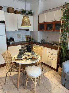 a kitchen with a table and chairs in a kitchen at Light Blue in Perea