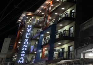 a building with a sign for a hotel at Hotel Sundaram 5 Minutes Distance from Dargah in Ajmer
