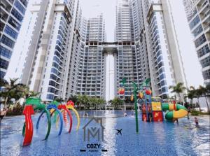 a water park in front of some tall buildings at Atlantis Premium 3BDR 4-12pax/5 min to jonker/town in Melaka