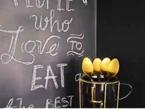 a blackboard with a sign that says wine love to eat at Kucica na brdu in Zaječar