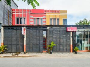 a building with a gate in front of it at SPOT ON 2451 Camel Residence in Semarang