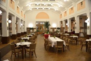a dining room with tables and chairs in a building at Masarykova Kolej in Prague