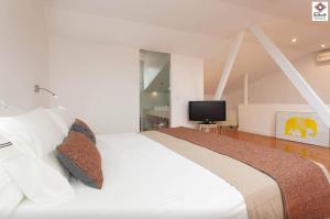 Letto o letti in una camera di Design Duplex Apartment BA/ Chiado