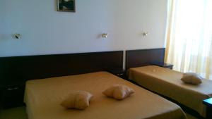 Llit o llits en una habitació de Hotel Blian
