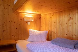 Letto o letti in una camera di Skihütte Zams