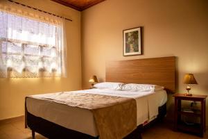 Letto o letti in una camera di Pousada Lua Luana