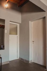 an empty room with a door and a ceiling at El Pedregal Cabaña rural 2 dorm Hasta 6 personas in Cafayate +43 photos