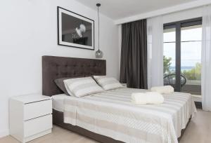 Postel nebo postele na pokoji v ubytování Villa Kuk with heated Pool Makarska